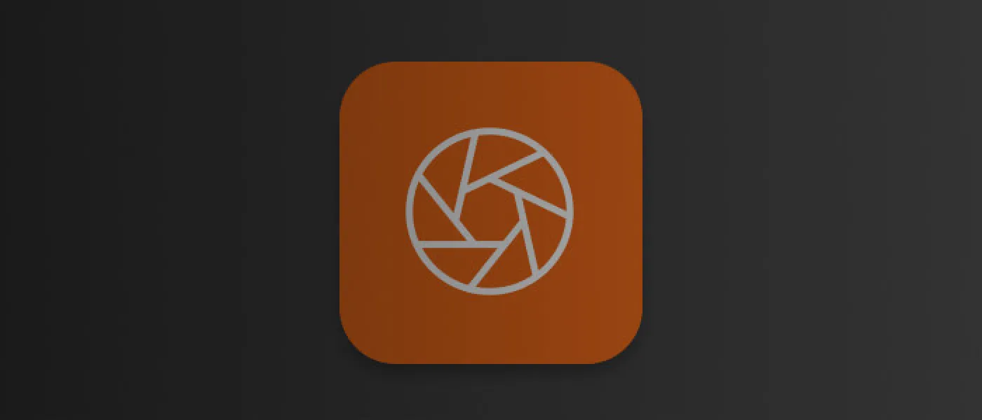 Orange app icon with a white camera shutter symbol on a dark background.