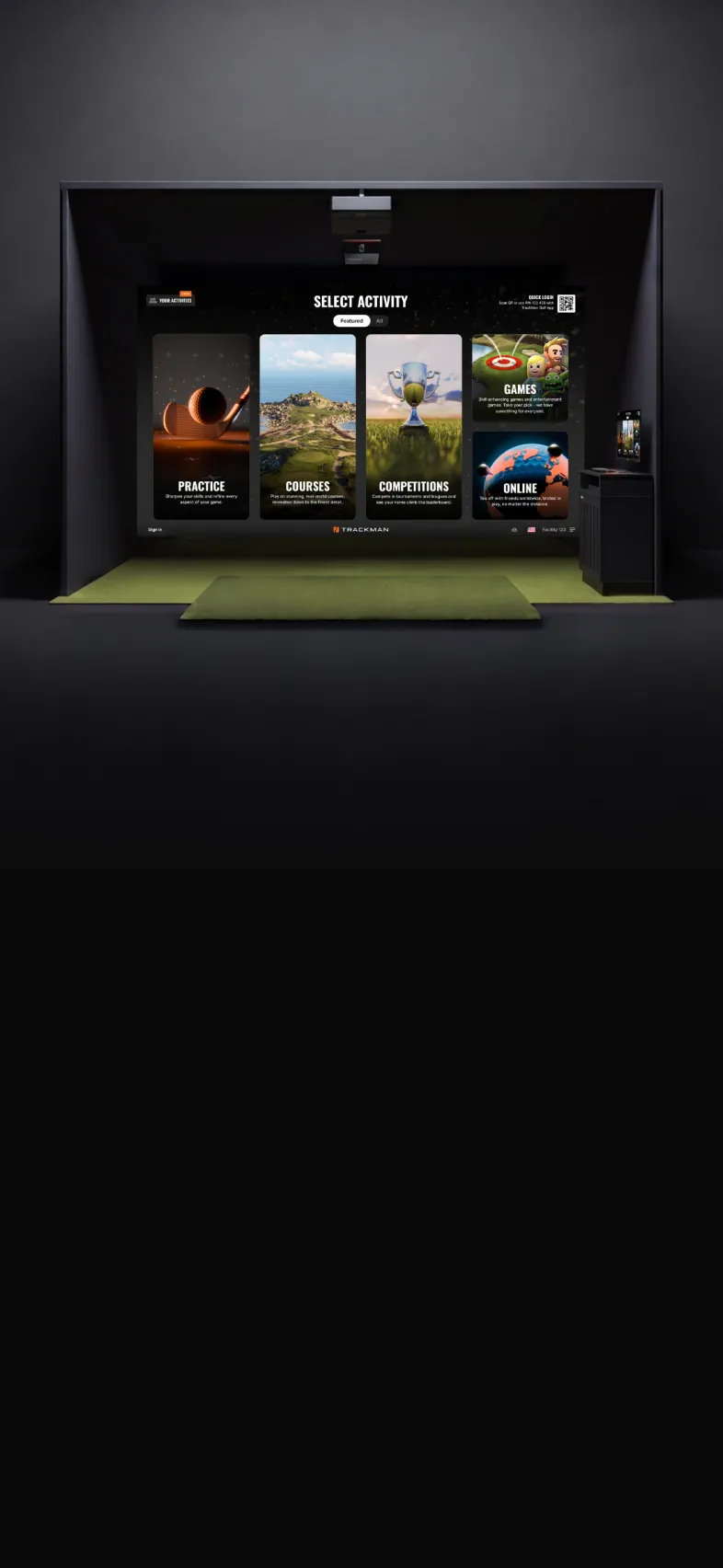 Golf simulator screen with activity options: Practice, Courses, Competitions, Games, and Online. Green carpet and sleek, dark interior.